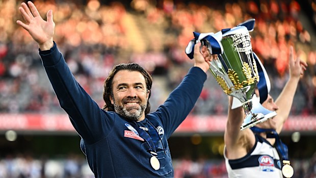 Chris Scott holds premiership cup