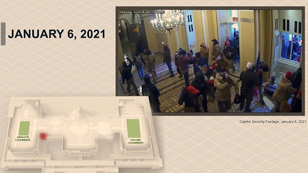 A security video showing rioters entering the Capitol.