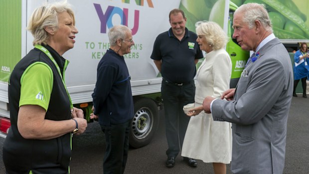 Britain's Prince Charles and Camilla, Duchess of Cornwall visit the Asda Distribution Centre, where they thanked staff who maintained the country's food supplies during the coronavirus lockdown, in Bristol, England, Thursday, July 9, 2020.