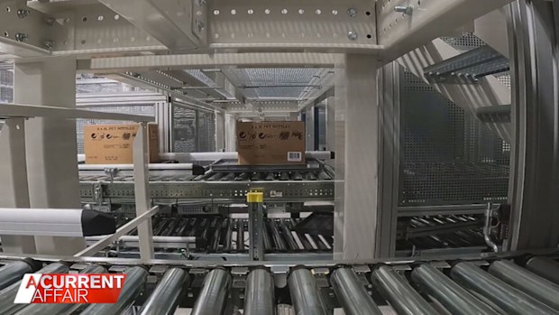 At Coles' brand new facility in Brisbane high-tech and high-speed warehouse workers are replaced by robotics and computer systems.
