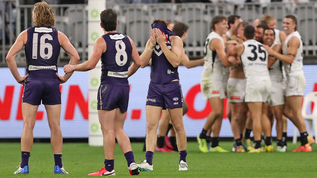 Reece Conca of the Dockers reacts as the Blues celebrate 