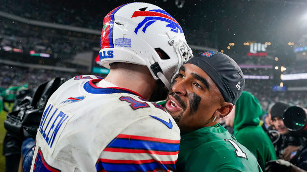 Philadelphia Eagles quarterback Jalen Hurts shares an embrace with Buffalo Bills quarterback Josh Allen after the game