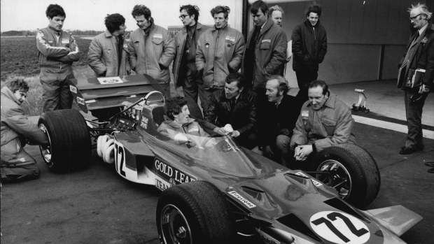Jochen Rindt and the Lotus team with their car for the 1970 season.