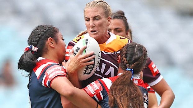 Ali Brigginshaw of the Broncos is tackled 
