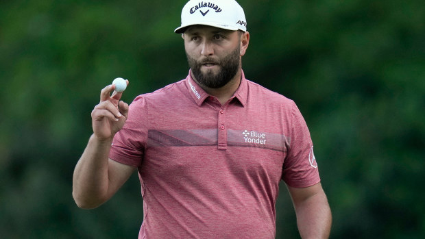 Jon Rahm acknowledges the crowd as he leaves the 13th hole in the final round of the Masters.