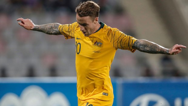 Adam Taggart celebrates scoring for the Socceroos