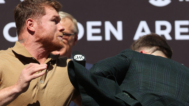 Canelo Alvarez and Caleb Plant come to blows during a face-off before a press conference ahead of their super middleweight fight on November 6.