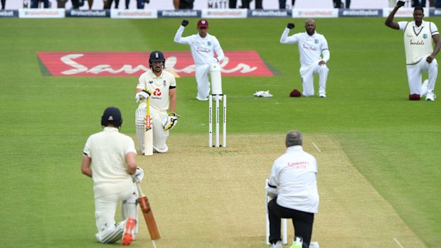 Rory Burns and Dom Sibley of England take a knee alongside Shane Dowrich, Jermaine Blackwood and Jason Holder of the West Indies