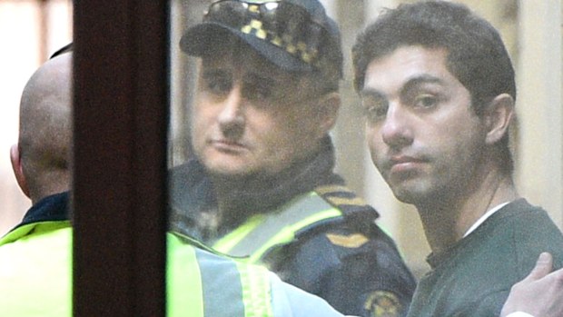 Kyle Zandipour (right) is put into a prison van at the Supreme Court in Melbourne. (AAP)