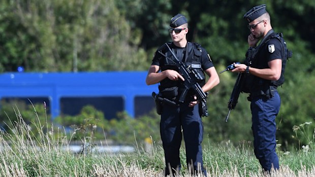 French gendarmes stand alert at the site after colleagues arrested a suspect on the A16 motorway, near Marquise, northern France following an attack on servicemen (Philippe HUGUEN / AFP).
