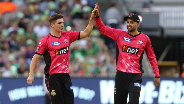 Sean Abbott and Nathan Lyon from the Sydney Sixers