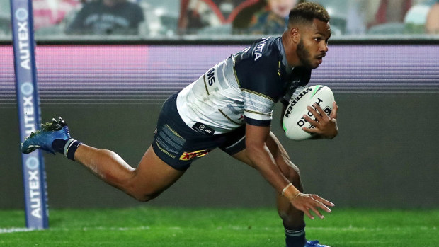 Hamiso Tabuai-Fidow of the Cowboys scores a try