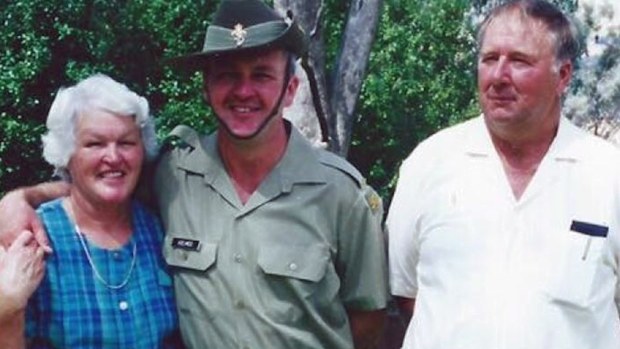 Greg Holmes (centre) with his parents Mary Lockhart and Peter Lockhart.