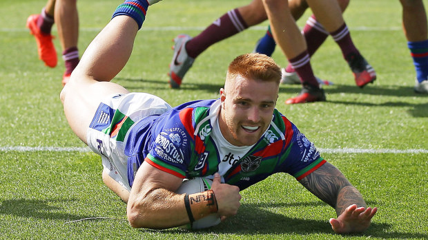 Adam Keighran of the Warriors scores a try