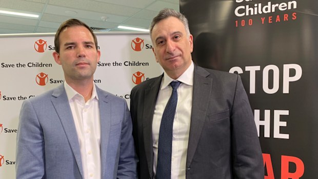 Save the Children's Mat Tinkler (left) and the father of an Australian woman in Syria, Kamalle Dabboussy (right) pose for a photo during a Save the Children Press conference urging the Australian government to do more to get over 60 women and children out of Syria's Al Hawl camp.