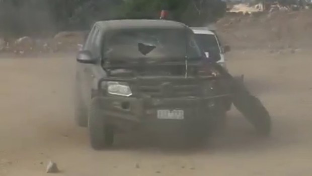 The windscreen of a 4WD was broken by flying rock.