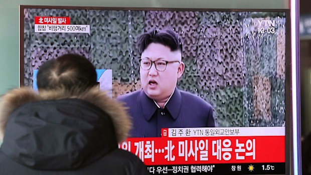 A man watches a TV news program showing a file footage of North Korean leader Kim Jong Un with letters reading: "The North fired a missile" at the Seoul Train Station in Seoul, South Korea. (AAP)