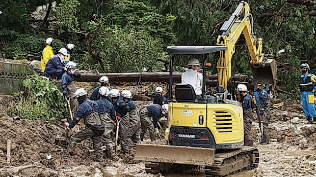 Firefighters search for missing people following heavy rain in an area in the Obama neighbourhood of Unzen, Nagasaki prefecture, southern Japan.