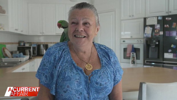 Sue Mariner and her pet bird Bud.
