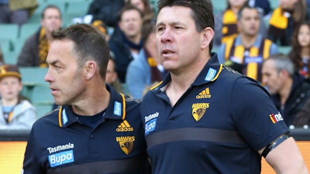 Alastair Clarkson the coach of the Hawks puts his arm around Brett Ratten the assistant coach 2015