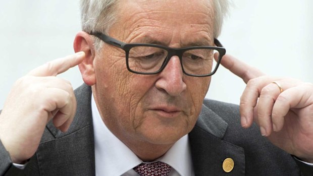 European Commission President Jean- Claude Juncker pretends to covers his ears as he arrives for an European People's Party. (EPA)