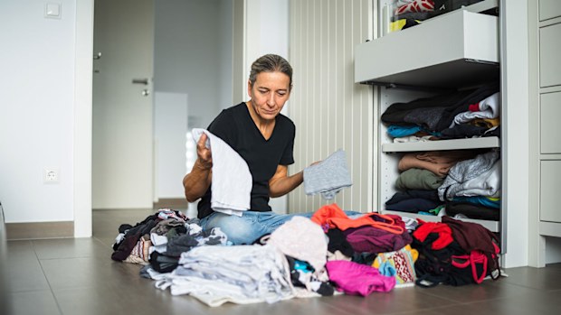 Woman decluttering dresser drawers