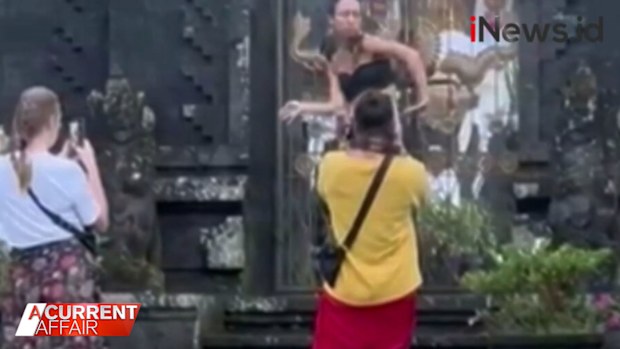Two other Russians were also kicked out after dancing and posing in inappropriate clothes at a temple.