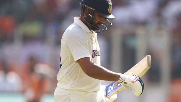 Rohit Sharma leaves the field after being dismissed by Matthew Kuhnemann.