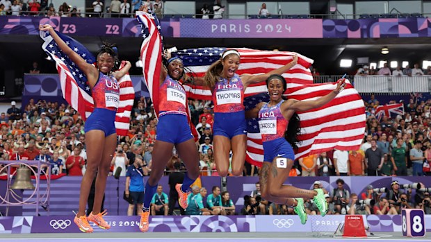 Sha'Carri Richardson and her USA teammates jump for joy after winning Olympic gold in the women's 4x100m relay.