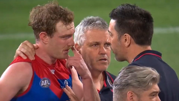 Harrison Petty is consoled by Mark Williams and Troy Chaplin