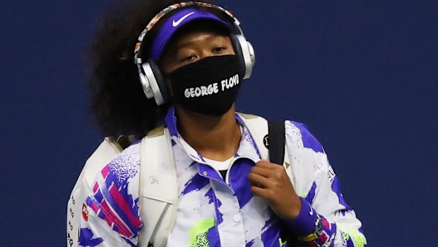 Noami Osaka wears a face mask bearing George Floyd's name.