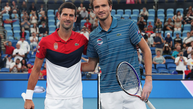 Novak Djokovic with Daniil Medvedev.