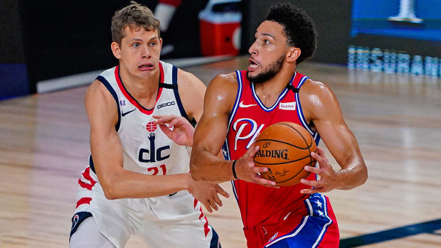  Ben Simmons #25 of the Philadelphia 76ers drives on Moritz Wagner #21 of the Washington Wizards
