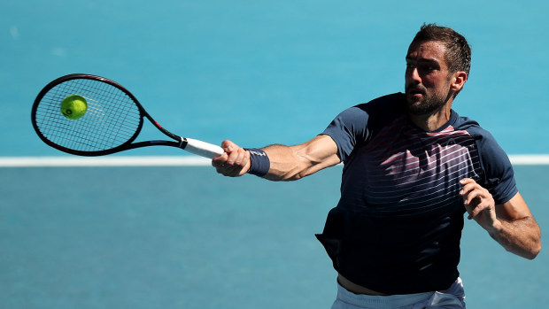  Marin Cilic of Croatia plays a forehand in his fourth round singles match against Felix Auger-Aliassime of Canada 