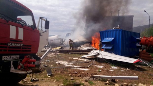 The plane requested an emergency landing before skidding off the runway and slamming into a building.