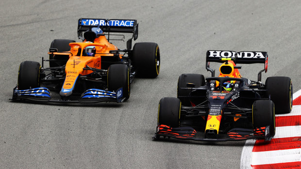 Daniel Ricciardo battles with Sergio Perez during the Spanish Grand Prix.