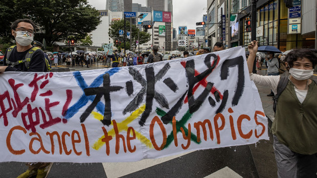Protesters march through Shinjuku area during a protest against the Tokyo 2020 Olympic Games.