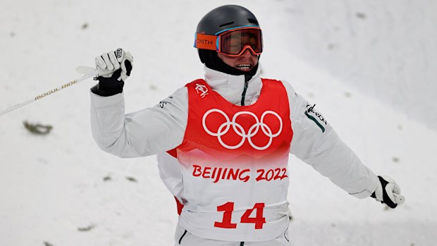 Cooper Woods of Team Australia reacts at the end of a run during the Men's Freestyle Skiing Moguls Final