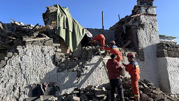 Rescue workers search for survivors in the aftermath of an earthquake in Changsuo Township of Dingri in Xigaze.