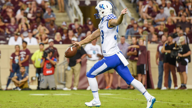 Wildcats punter Max Duffy (93) kicks during the game between the Kentucky and Texas A&M Aggies 