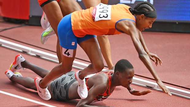 Sifan Hassan of Team Netherlands and Edinah Jebitok of Team Kenya trip and fall during round one of the Women's 1500m heats