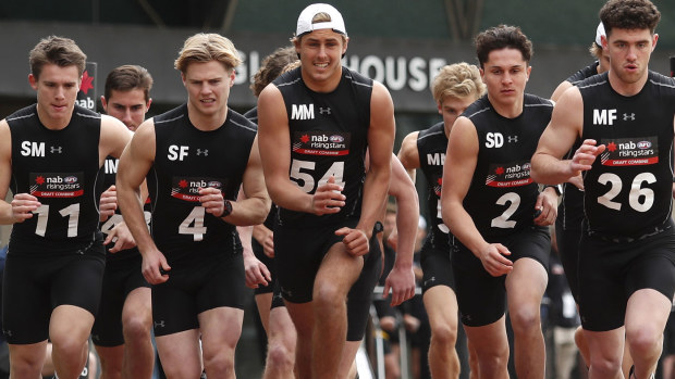 Caleb Serong (11), Ned Cahill (4), Jeremy Sharp (54), Trent Bianco (2) and Sam Flanders (26) complete the 2km time trial during the 2019 AFL Draft Combine