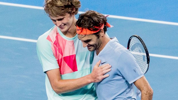 German teen Alexander Zverez embraces Roger Federer after beating the Swiss champion in three sets at the Hopman Cup in Perth. (AAP)