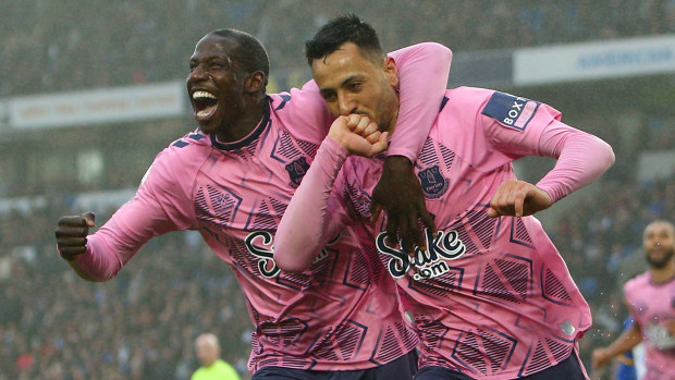 Dwight McNeil of Everton celebrates with teammate Abdoulaye Doucoure after scoring the team's fourth goal during the Premier League match between Brighton & Hove Albion and Everton FC at American Express Community Stadium on May 08, 2023 in Brighton, England. (Photo by Charlie Crowhurst/Getty Images)