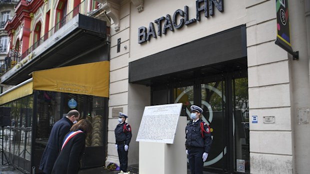 French Prime Minister Jean Castex, left, and Paris Mayor Anne Hidalgo participate in a wreath laying ceremony, marking the 5th anniversary of the Nov. 13, 2015 attacks outside the Bataclan concert hall in Paris, Friday, Nov. 13, 2020