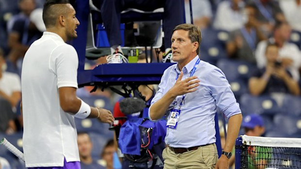 Nick Kyrgios of Australia discusses a ruling with tournament official Remy Azemar 