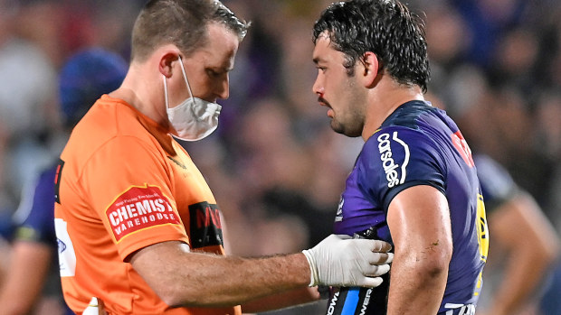  Brandon Smith of the Storm is assisted by a trainer after a head knock