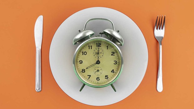 Fasting clock on an empty plate