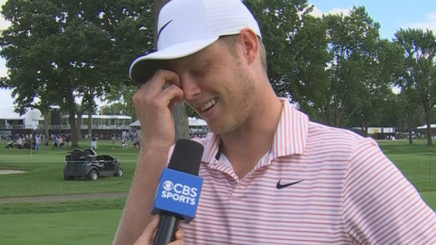 Cameron Davis gets emotional in an interview after winning the Rocket Mortgage Classic.