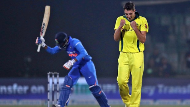 Australia's Pat Cummins celebrates the wicket of India's Kedar Jadhav during the final one day international cricket match between India and Australia.